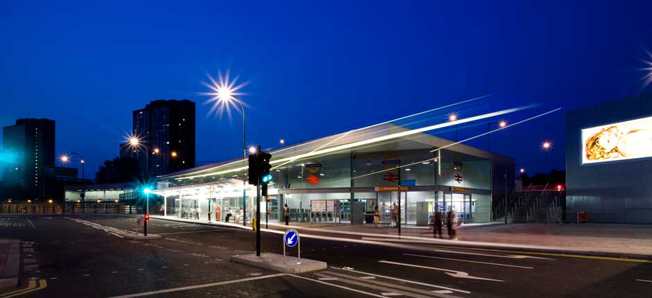 Night time photograph of front elevation to Shepherds Bush Station by block 9 Architects Edinburgh